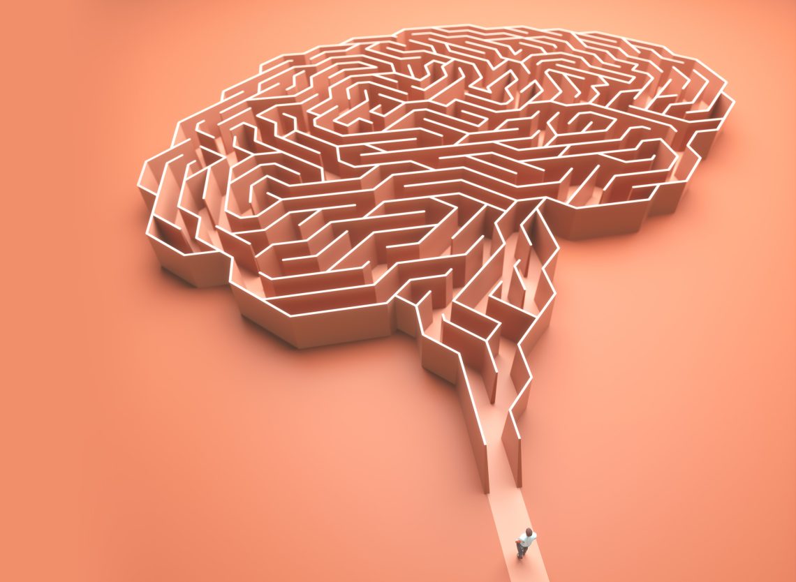 Illustration eines Gehirns als Labyrinth mit einer Person am Eingang