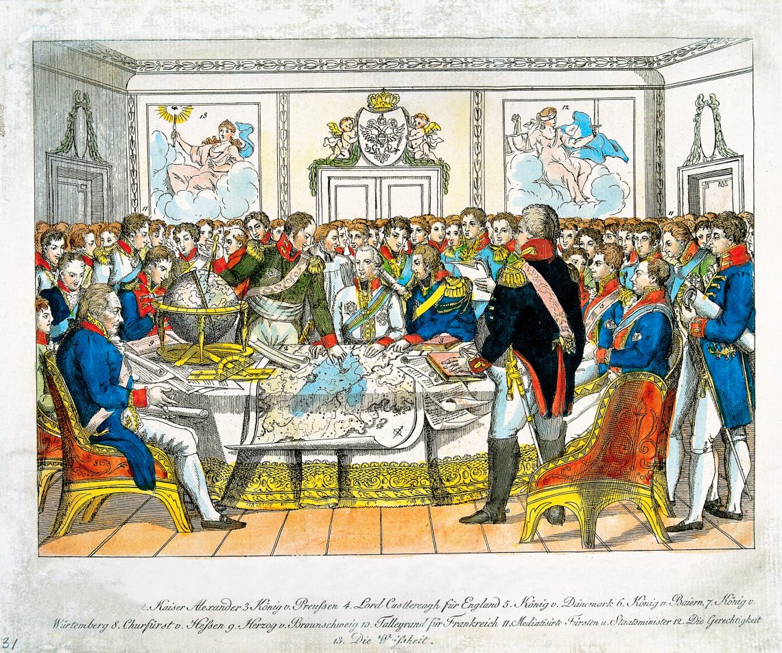 Ein illustrierter Stich vom Wiener Kongress 1814/15 aus dem 19. Jahrhundert zeigt die Fürsten Europas um eine Landkarte sitzend.